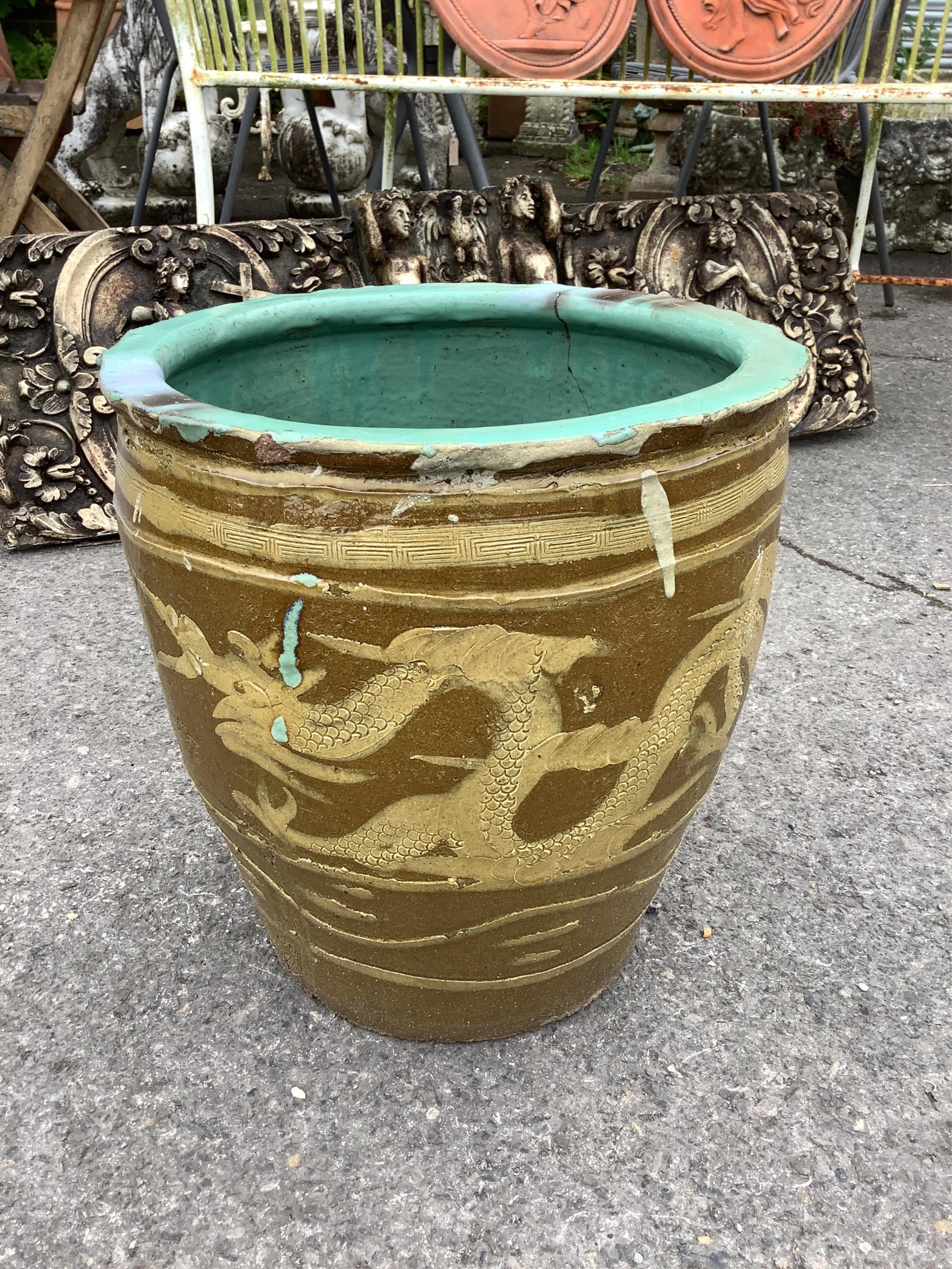 A pair of Chinese style circular earthenware garden planters, diameter 36cm, height 39cm